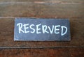 Reserved Sign On Wooden Table Royalty Free Stock Photo