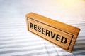 Reserved table. reserved wooden sign on table for reservation pl