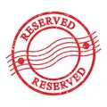 RESERVED, text written on red postal stamp Royalty Free Stock Photo