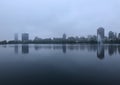 Reservoir and city skyline during late evening hours Royalty Free Stock Photo