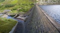 Reservoir and dam with high water level overlooking pumping station