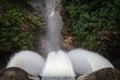 The reservoir discharges the flood and the water flows into a waterfall