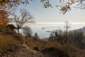 Reservoir from steep coast overgrown with trees in morning haze Royalty Free Stock Photo