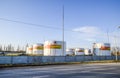 Reservoirs with fuel at the oil depot of Rosneft. Tanks in the light of the setting sun.