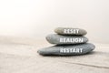 Reset, Realign and Restart. Motivational advice or reminder, on the stones Royalty Free Stock Photo