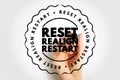 RESET REALIGN RESTART stamp design with hand holding marker, circular emblem stressing transformational wording, ideal for Royalty Free Stock Photo