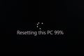 Resetting PC message on black screen. Royalty Free Stock Photo