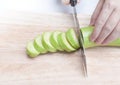 Resh green eggplant sliced on wooden board Royalty Free Stock Photo