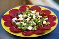 Resh vegetarian salad. Beetroot salad, macro photo. Beetroot salad with onions, cheese, nuts served in plate