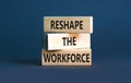 Reshape the workforce and support symbol. Concept words Reshape the workforce on wooden blocks. Beautiful grey table grey Royalty Free Stock Photo