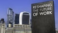 Reshaping the Future of wor on a sign in front of the City of London