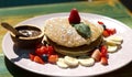 Reshly baked pancakes, chocolate sauce and fruits