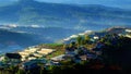 Residence, mountain chain with pine forest in foggy Royalty Free Stock Photo