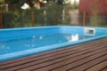 Residence with swimming pool and deck Royalty Free Stock Photo