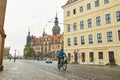 A resident of a European city goes about his business on a bicycle