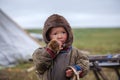A resident of the tundra, The extreme north, the pasture of Nenets people, children on vacation playing near reindeer pasture