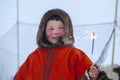 A resident of the tundra, indigenous residents of the Far North, Girl holding a sparkler, Little girl in red clothes, The girl