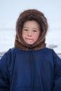 A resident of the tundra, indigenous residents of the Far North, tundra, open area, children ride on sledges, children in