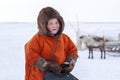 A resident of the tundra, indigenous residents of the Far North, open area, Little girl in red national clothes