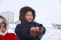 A resident of the tundra, indigenous residents of the Far North, tundra, open area, children ride on sledges, children in
