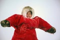 A resident of the tundra, indigenous residents of the Far North, tundra, open area, small girl ride on sledges, little girl in