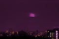 Residental buildings and condominium at night. Residential neighborhoods of the city in the night light. Apartments and purple sky