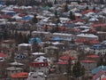 Residential area in ReykjavÃÂ­k, capital of Iceland, with buildings, colorful rooftops and trees in between on cloudy day.