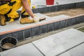 Backyard Garden Concrete Bricks Paving Performed by Professional Worker Royalty Free Stock Photo