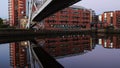 Residential block and footbridge with their reflection at Clarence Dock, Leeds Royalty Free Stock Photo
