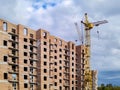 Brick house under construction and crane Royalty Free Stock Photo