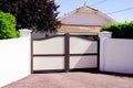 Residential brown sandy portal home suburb metal aluminum house gate street wall