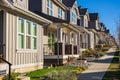 Residential building Real Estate Exterior Front Houses in Canada. A perfect neighbourhood. Houses in suburb at spring Royalty Free Stock Photo