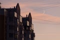 The residential building reflects in the tile and glass a beautiful sunset sky against the backdrop of a growing moon. Royalty Free Stock Photo