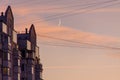 The residential building reflects in the tile and glass a beautiful sunset sky against the backdrop of a growing moon. Royalty Free Stock Photo