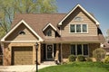 residential building suburban house architecture in neighborhood of america with garage Royalty Free Stock Photo