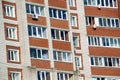 Residential building wall with windows and balconies Royalty Free Stock Photo