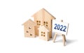 Residential buildings and easel 2022. Concept of real estate market in new year. Housing market predictions, trends and tendencies