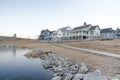 Residential buildings exterior near the lake with rocky shorelines