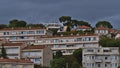 Residential buildings in mediterranean style on a hill with sea view in small town Cassis at the French Riviera. Royalty Free Stock Photo
