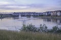 Residential complex apartments with lake and fountains in foreground