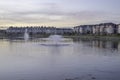 Residential complex apartments with lake and fountains in foreground