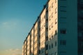 Residential condominium apartment building with windows facing west side lit by the sunset sun Royalty Free Stock Photo