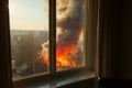 Residential danger view from an apartment window shows a nearby wildfire