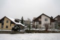 Residential district of Swiss village Urdorf in winter under snow.