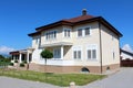 Residential family and business house with closed wooden window blinds Royalty Free Stock Photo