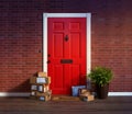 Residential front door with stacks of boxes from online purchases