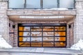 Residential home with glass paned garage door and clearance sign below balcony Royalty Free Stock Photo