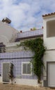 Residential home with traditional house facade decorated with Portuguese azulejo tiles, Tavira, Portugal Royalty Free Stock Photo