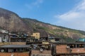 Residential roof tops of slums and a hillside in the background at the Rocinha favela in Rio de Janeiro, Brazil, South America