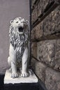 MOSCOW, RUSSIA. Figure of sitting lion at the entrance to the arch of a residential building number 38 on Goncharnaya street.